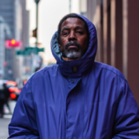 A man on NYC street, with face